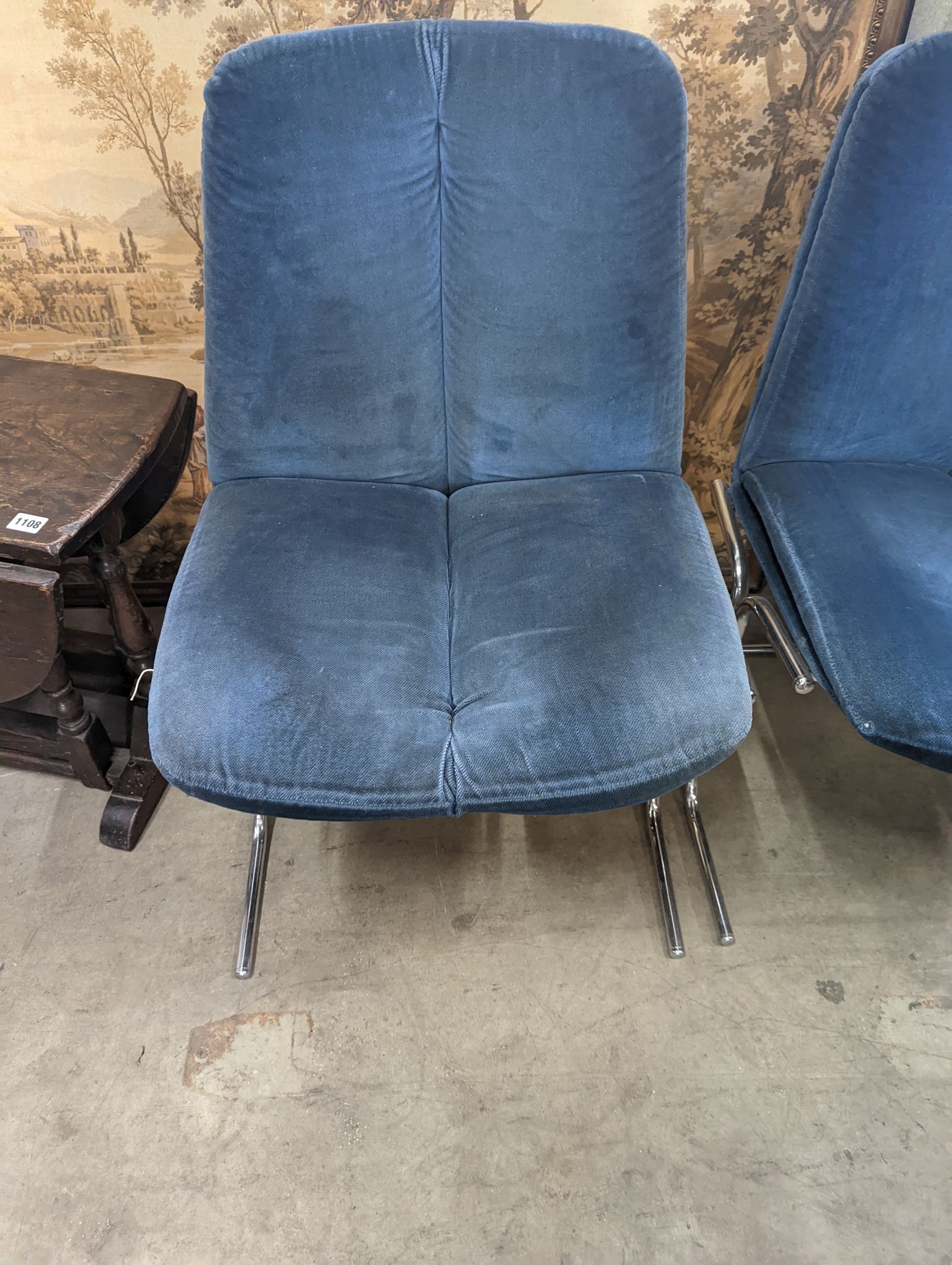 A pair of mid century blue fabric dining chairs